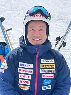 A smile on her face against the backdrop of snow